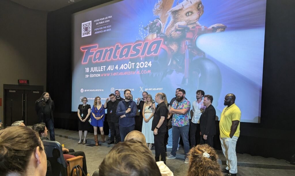 Fantasia 2024 Recap: A Celebration of Weird, Wild, and Wonderful Cinema Chris Stuckmann and Mike Flanagan with some of the cast and crew from Shelby Oaks.